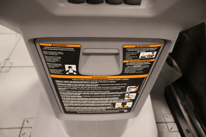 Slide: The Image of 2023 Sea-Doo Switch 16 warning labels on dashboard, emphasizing safety precautions. - 18