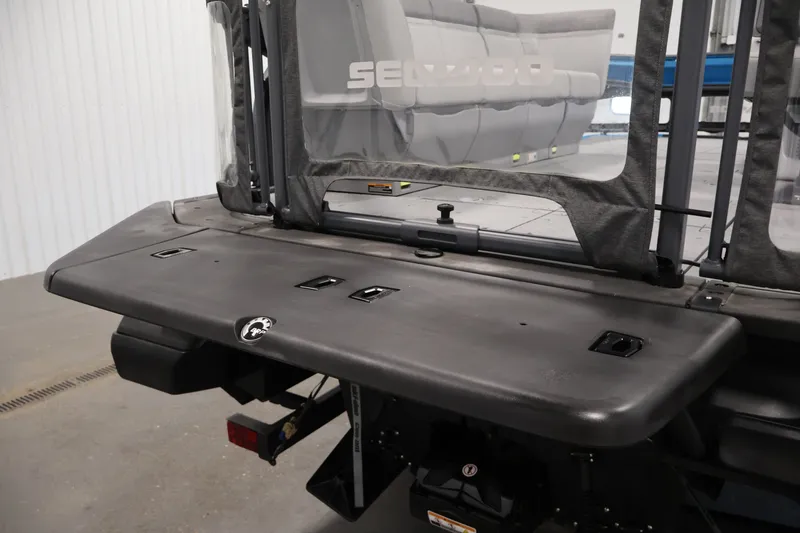 Slide: The Image of 2023 Sea-Doo Switch 16 rear deck with seating and storage features. - 25