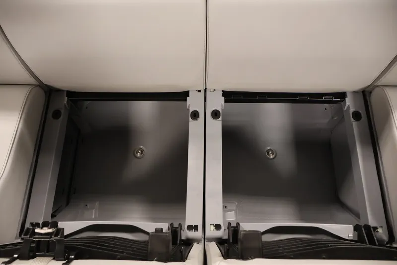 Slide: The Image of 2023 Sea-Doo Switch 16 storage compartments with open lids, showcasing interior space. - 24