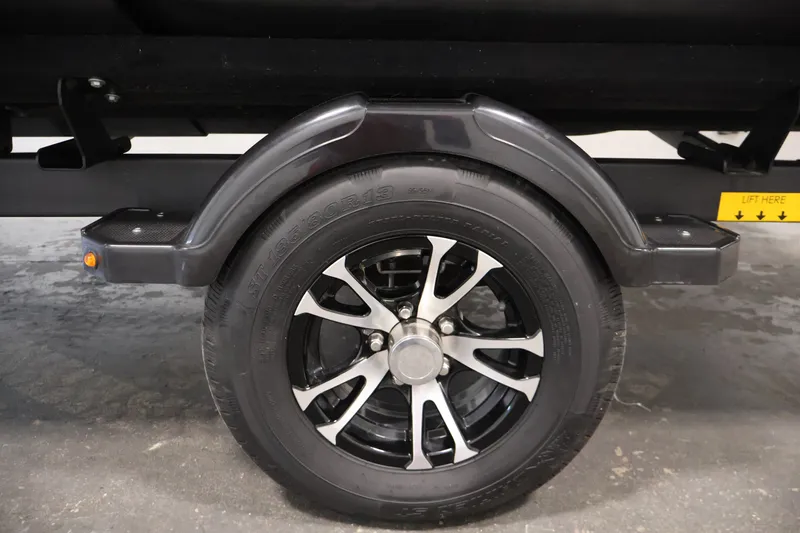 Slide: The Image of 2023 Sea-Doo Switch 16 trailer wheel with black and silver alloy rim. - 32