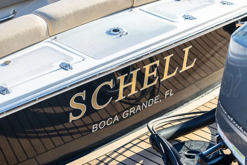 Slide: The Image of 2018 Hunt Yachts Harrier 26 boat with "SCHELL" name, docked in Boca Grande, FL. - 29