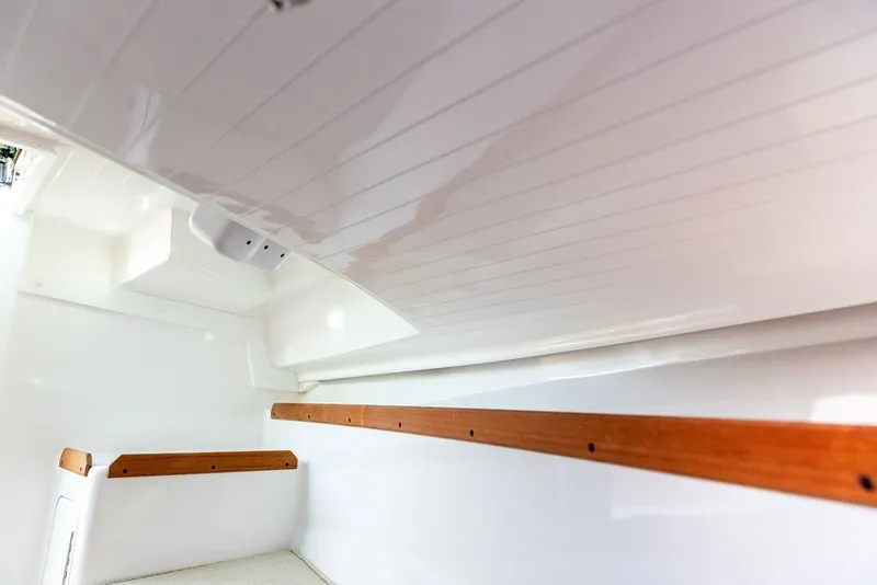 Slide: The Image of Interior cabin of 2018 Hunt Yachts Harrier 26 with wooden accents. - 27