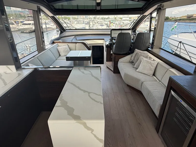 Slide: The Image of Interior of a 2023 Sunseeker Predator 65 with modern seating and sleek design. - 22