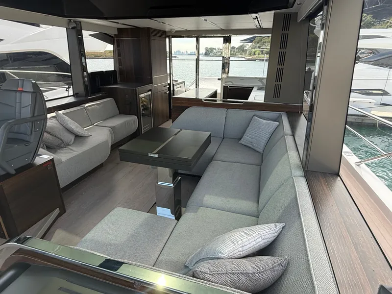 Slide: The Image of Interior of the 2023 Sunseeker Predator 65 with sleek gray sofas and modern design. - 23