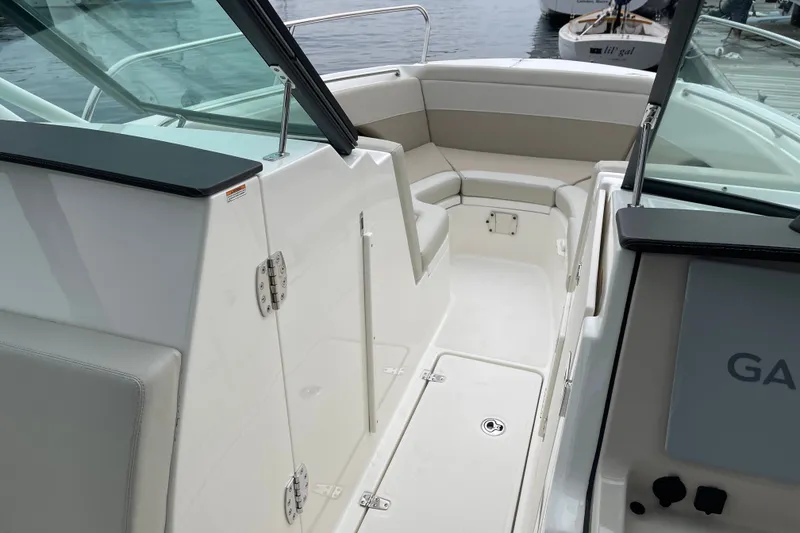 Slide: The Image of 2023 Boston Whaler 240 Vantage boat interior with seating and storage. - 60