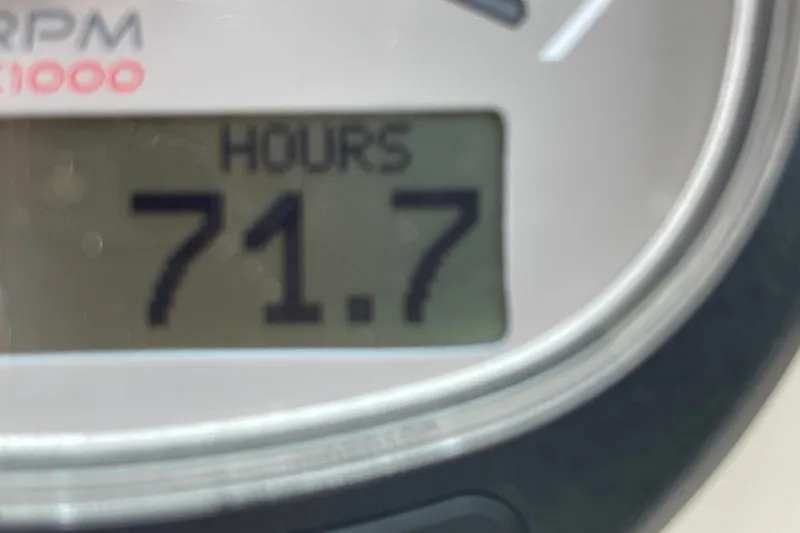 Slide: The Image of Close-up of a 2023 Boston Whaler 240 Vantage engine hour meter displaying 71.7 hours. - 89