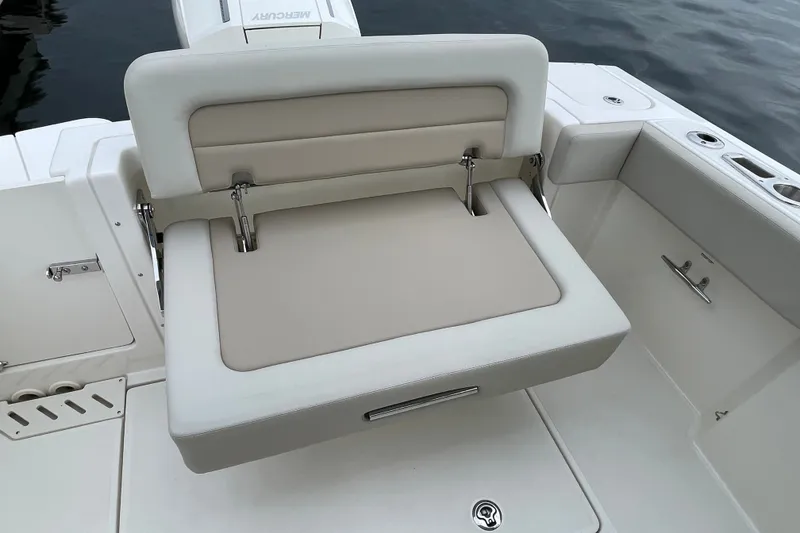 Slide: The Image of 2023 Boston Whaler 240 Vantage boat seat with beige upholstery and adjustable backrest. - 71