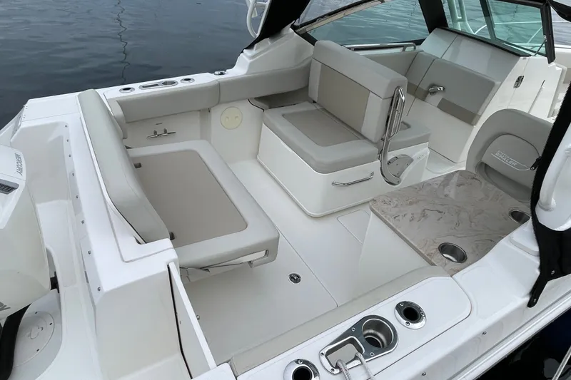 Slide: The Image of 2023 Boston Whaler 240 Vantage boat interior with seating and table. - 36