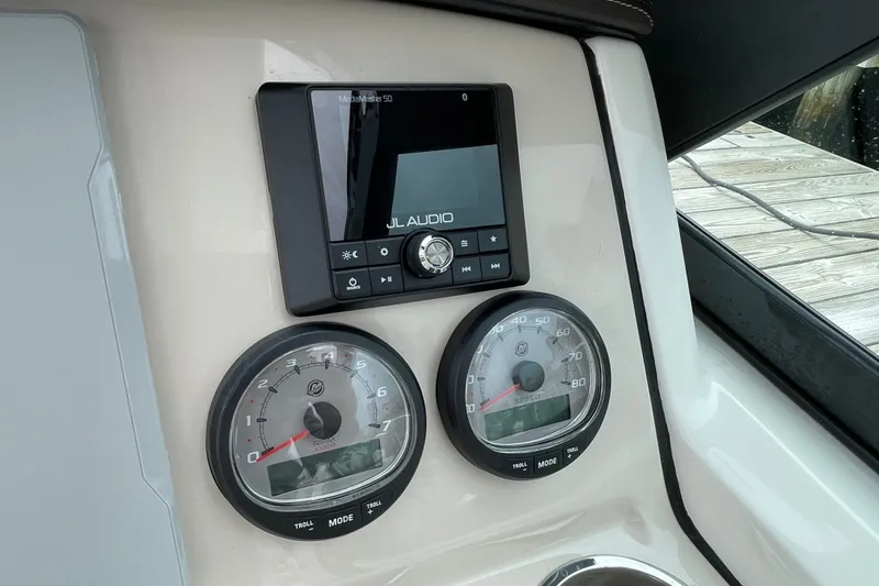 Slide: The Image of Dashboard of 2023 Boston Whaler 240 Vantage with JL Audio system and gauges. - 54