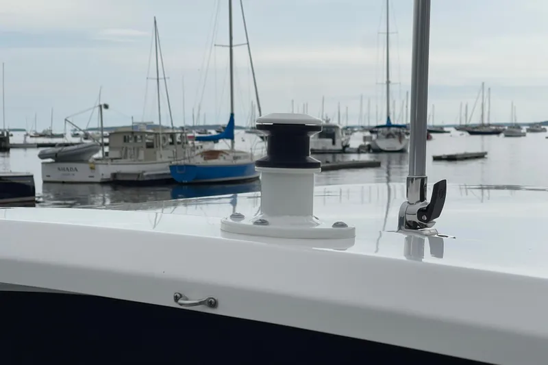 Slide: The Image of 2023 Boston Whaler 240 Vantage boat detail with marina background. - 77