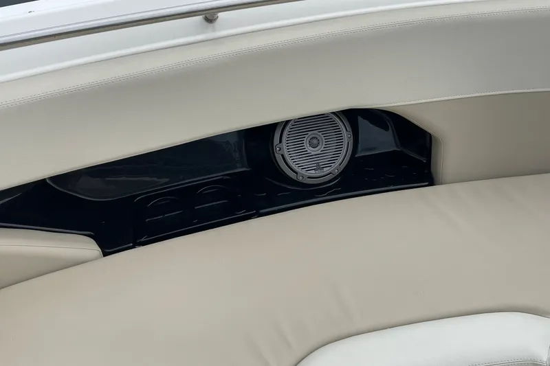 Slide: The Image of 2023 Boston Whaler 240 Vantage boat interior with speaker and cushioned seating. - 62