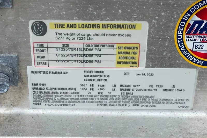 Slide: The Image of Tire and loading information label on a 2023 Boston Whaler 240 Vantage trailer. - 87