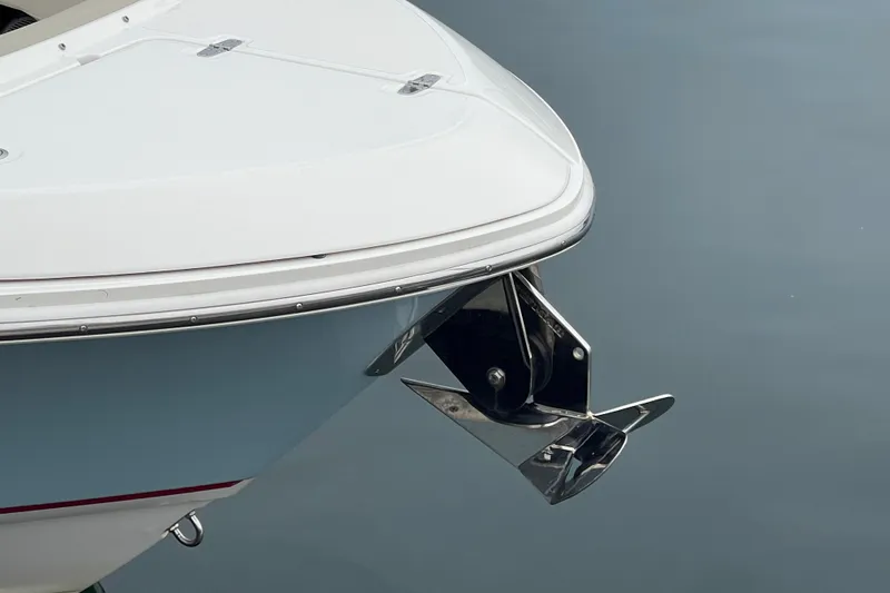 Slide: The Image of Bow of 2023 Boston Whaler 240 Vantage with anchor, on calm water. - 11