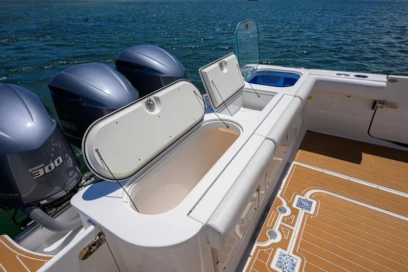 Slide: The Image of 2018 Everglades 355 Center Console boat with Yamaha engines on open water. - 47