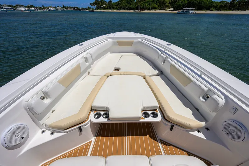 Slide: The Image of Bow seating area of 2018 Everglades 355 Center Console boat on water. - 20