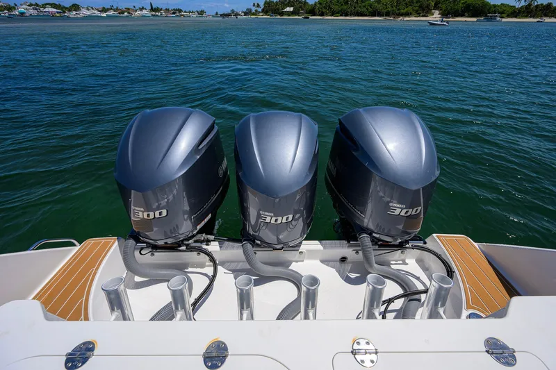 Slide: The Image of Triple Yamaha 300 engines on a 2018 Everglades 355 Center Console boat. - 58