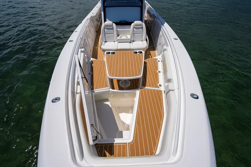 Slide: The Image of 2018 Everglades 355 Center Console boat with teak deck, on calm water. - 29