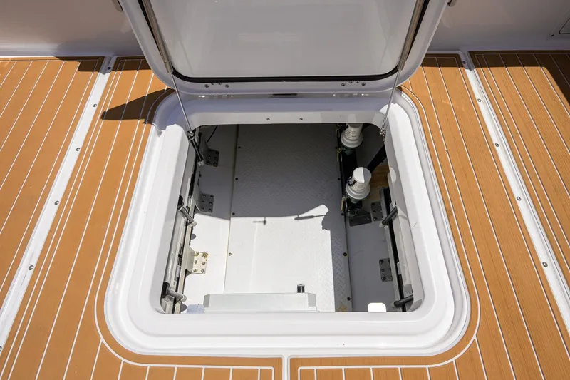 Slide: The Image of Open hatch on 2018 Everglades 355 Center Console boat deck. - 44