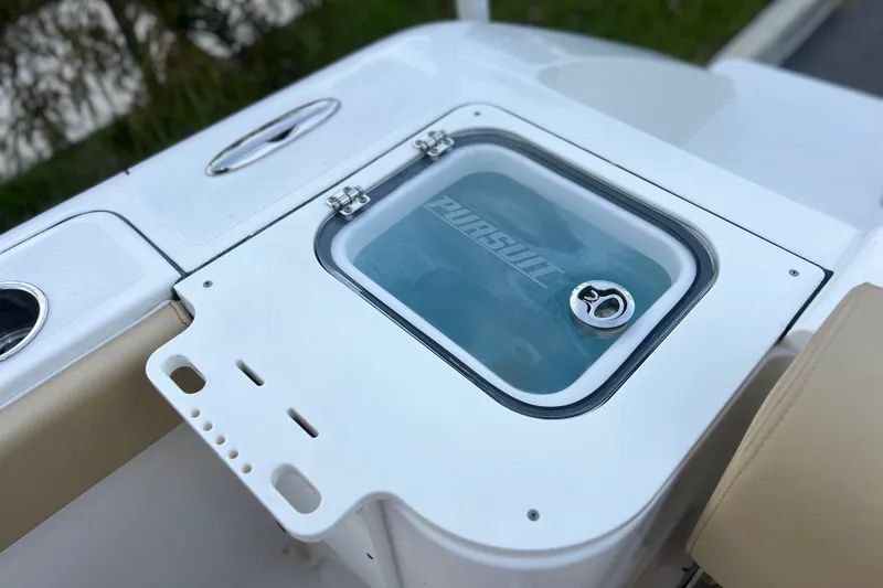 Slide: The Image of 2017 Pursuit C 238 Center Console boat detail with storage compartment. - 74