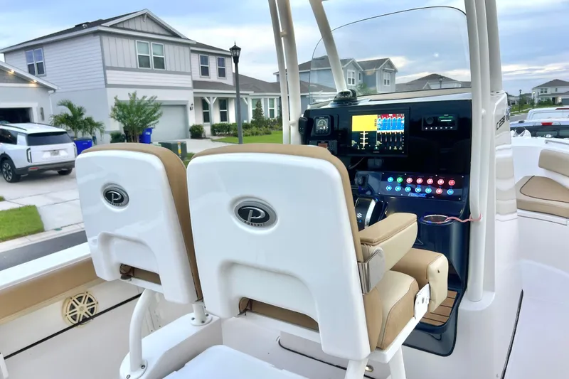 Slide: The Image of 2017 Pursuit C 238 Center Console boat interior with modern dashboard and seating. - 68