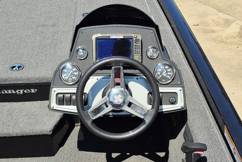 Slide: The Image of 2019 Ranger RT188 boat dashboard with steering wheel and gauges. - 12
