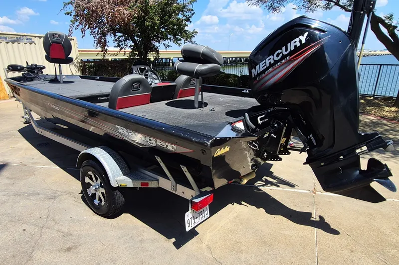 Slide: The Image of 2019 Ranger RT188 boat with Mercury engine, parked outdoors on a sunny day. - 8