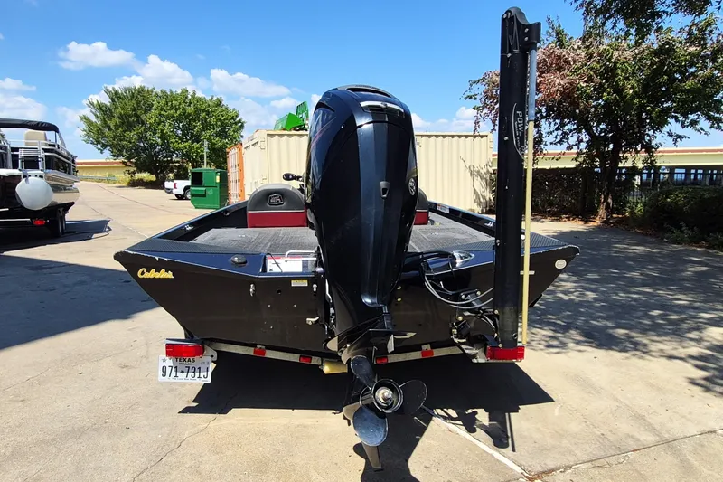 Slide: The Image of 2019 Ranger RT188 boat with outboard motor, parked outdoors on a sunny day. - 7