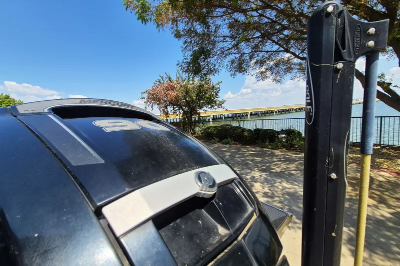 Slide: The Image of 2019 Ranger RT188 boat with Mercury engine by a scenic lakeside. - 9