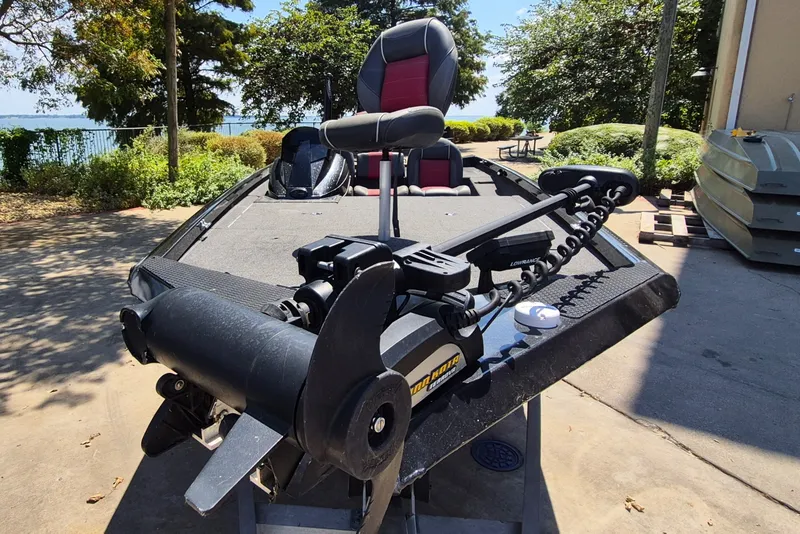 Slide: The Image of 2019 Ranger RT188 boat with trolling motor, parked near a lakeside. - 3