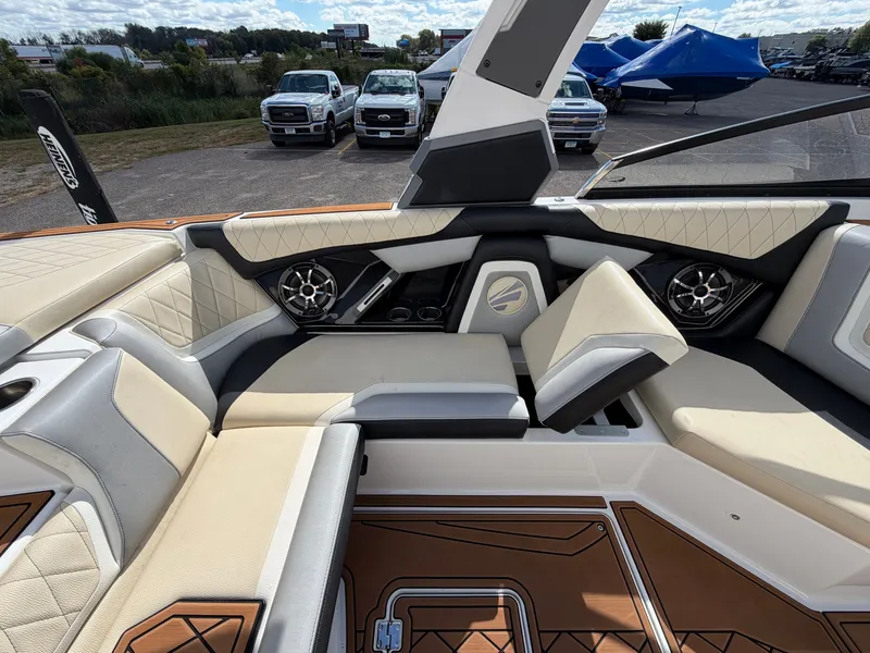 Slide: The Image of The image shows the interior of a 2019 Tigé 20RZX boat with luxurious seating and speakers. - 27