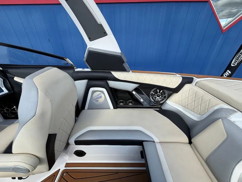 Slide: The Image of Interior of a 2019 Tigé 20RZX with sleek seating and modern speakers. - 26