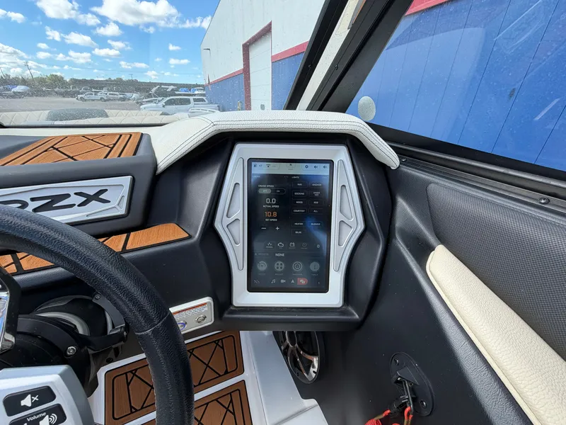 Slide: The Image of The image shows the dashboard of a 2019 Tigé 20RZX with a modern touchscreen display. - 30