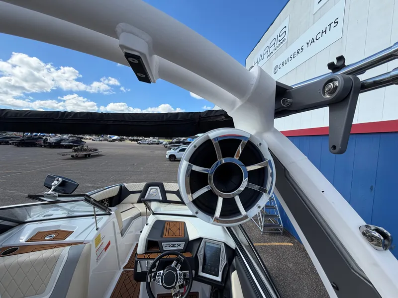 Slide: The Image of The image shows the cockpit of a 2019 Tigé 20RZX with modern speakers and sleek design. - 15