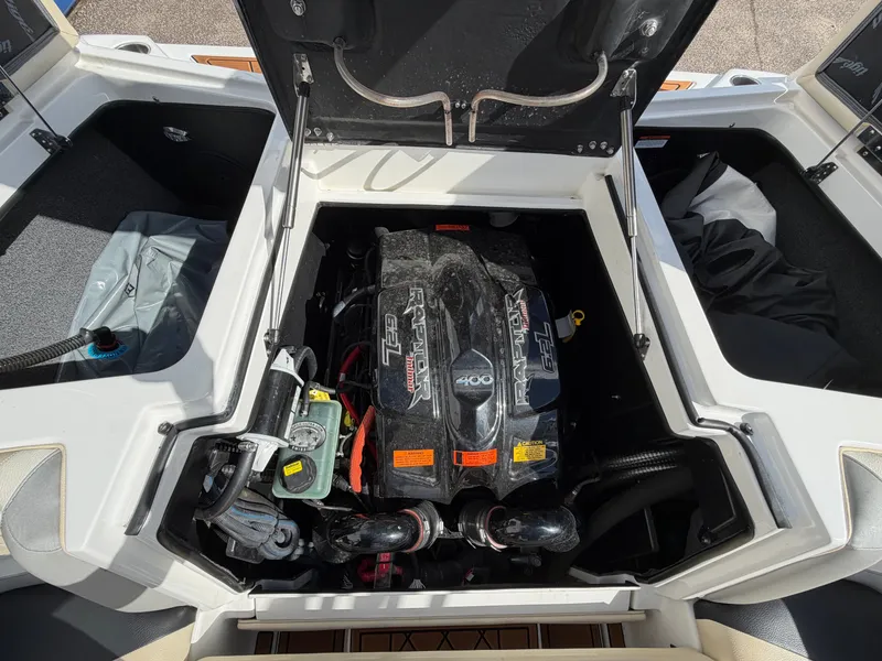 Slide: The Image of The engine compartment of a 2019 Tigé 20RZX boat with a powerful engine. - 9