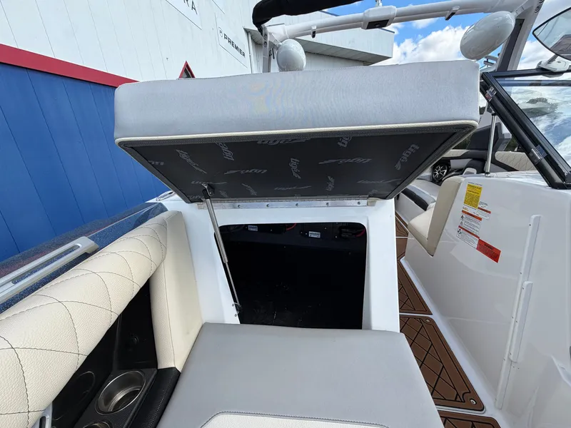 Slide: The Image of The image shows the interior of a 2019 Tigé 20RZX with a seat lifted up. - 44