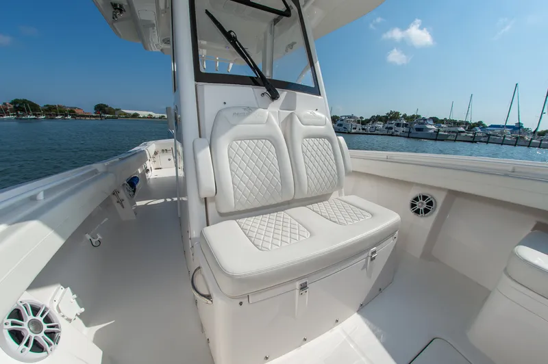 Slide: The Image of 2024 Regulator 31 with cushioned seating and a clear view of the harbor. - 18