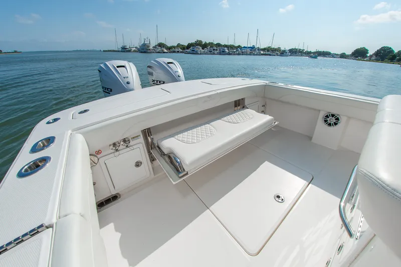 Slide: The Image of The image shows the stern of a 2024 Regulator 31 boat with two outboard engines. - 10