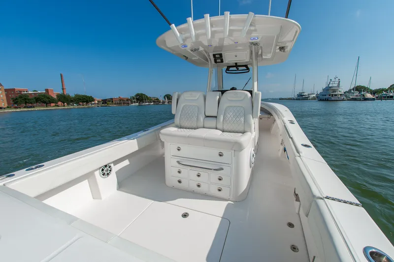 Slide: The Image of The image shows a 2024 Regulator 31 boat with a spacious white deck and comfortable seating. - 4