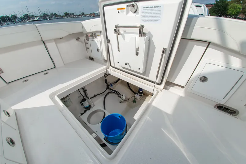 Slide: The Image of 2024 Regulator 31 with open storage compartment and buckets in the cockpit. - 20