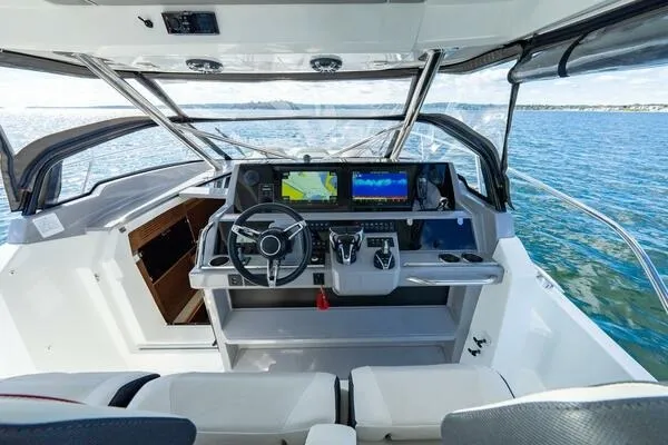 Slide: The Image of Cockpit of 2021 Jeanneau Leader 12.5 WA boat with modern navigation equipment. - 7