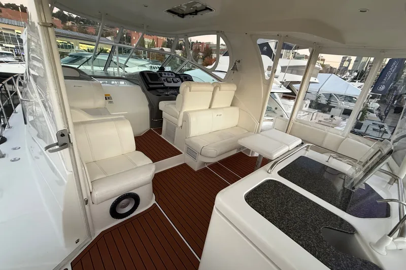 Slide: The Image of Luxurious 2006 Cruisers Yachts 415 Express Motoryacht interior with plush seating and modern helm. - 2