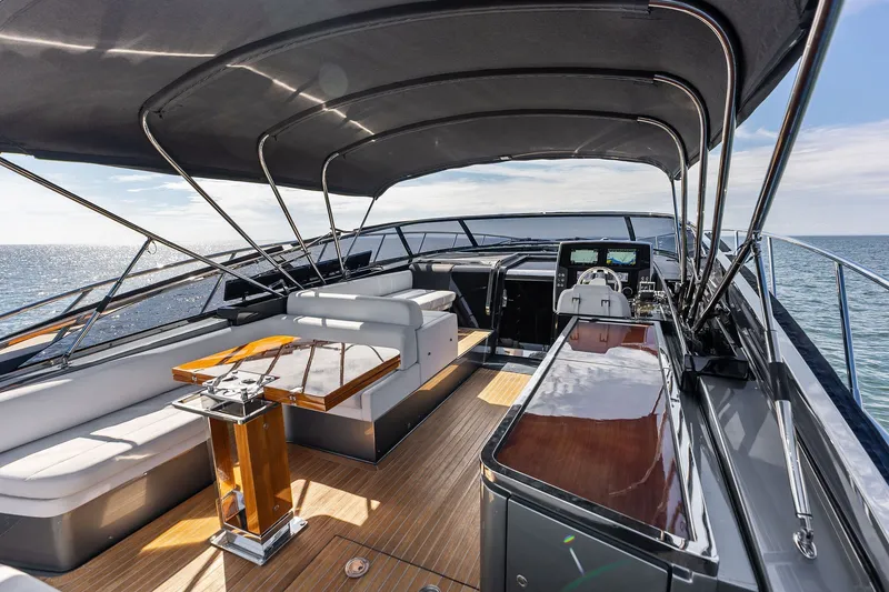 Slide: The Image of Luxurious 2019 Riva 56' Rivale yacht interior with elegant seating and ocean view. - 17