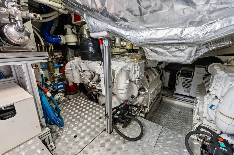Slide: The Image of Engine room of 2019 Riva 56' Rivale yacht, showcasing machinery and equipment. - 57