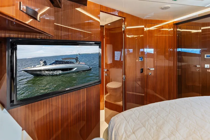 Slide: The Image of Luxurious interior of 2019 Riva 56' Rivale yacht with wood paneling and TV display. - 40