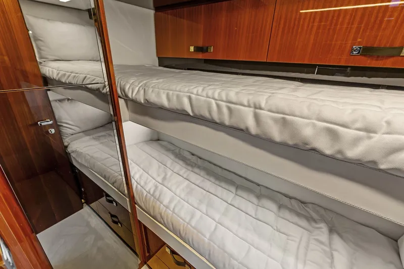 Slide: The Image of Luxurious 2019 Riva 56' Rivale yacht interior with elegant wooden bunk beds. - 49