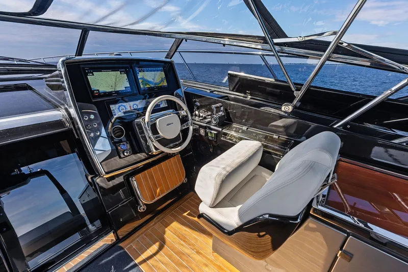 Slide: The Image of Cockpit of 2019 Riva 56' Rivale yacht with modern navigation controls. - 23