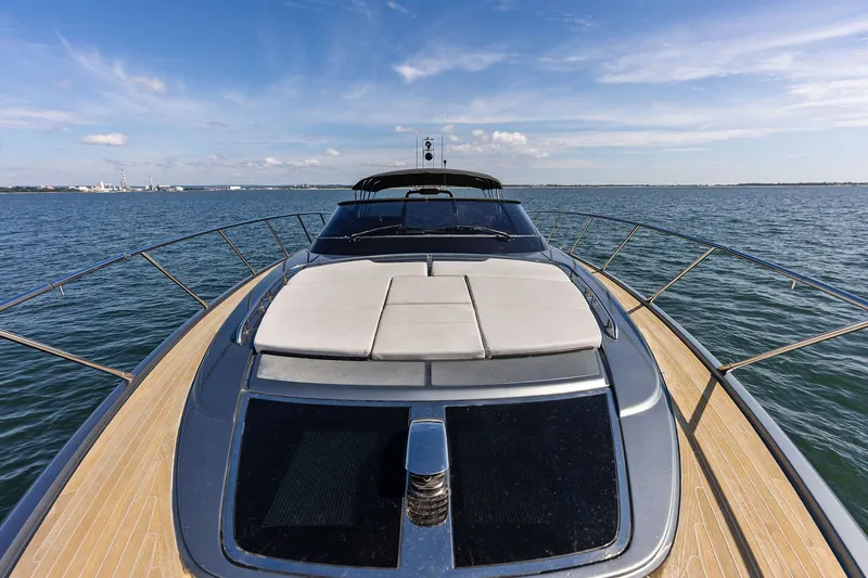 Slide: The Image of 2019 Riva 56' Rivale yacht cruising on open water under clear skies. - 15