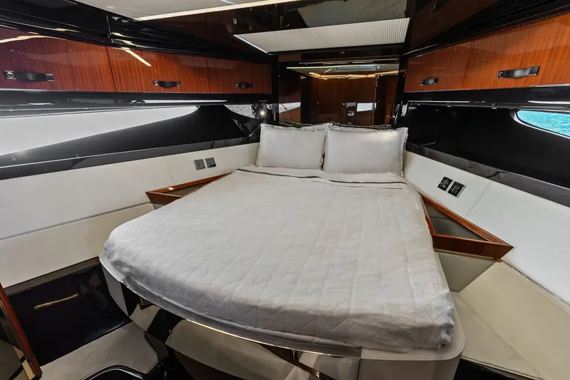 Slide: The Image of Luxurious bedroom interior of 2019 Riva 56' Rivale yacht with elegant wood finishes. - 38