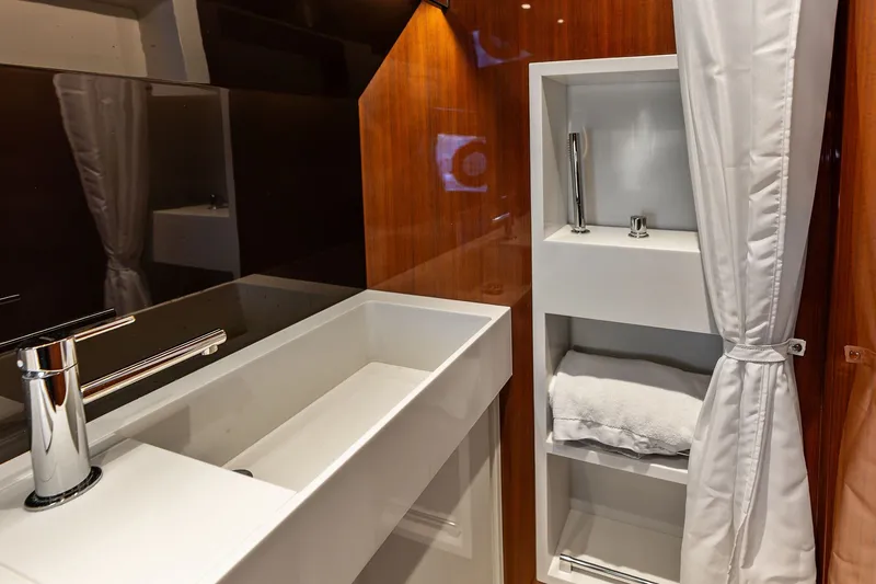 Slide: The Image of Luxurious bathroom interior of 2019 Riva 56' Rivale yacht with modern sink and shelving. - 36