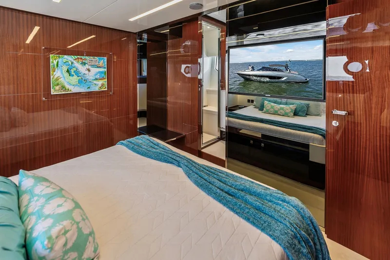 Slide: The Image of Luxurious 2019 Riva 56' Rivale yacht bedroom with elegant wood paneling and modern decor. - 46